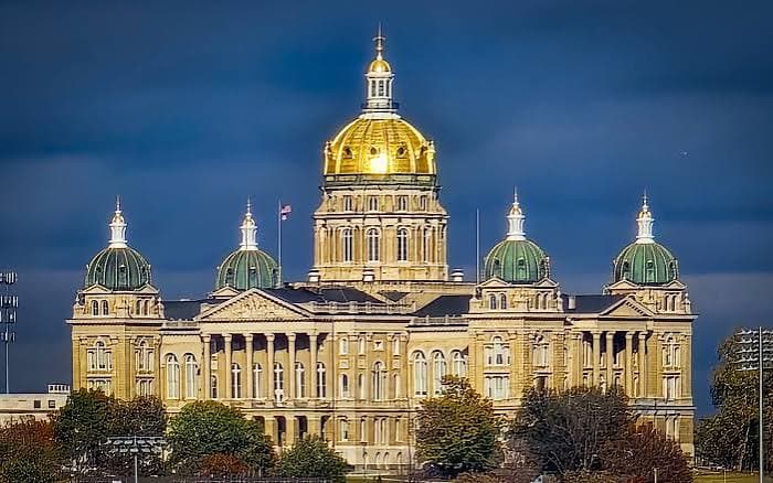 The gold dome and facade of the Iowa State Capitol